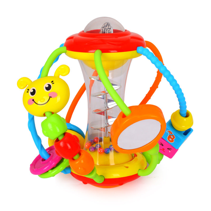 Baby hand holding rattle ball toy